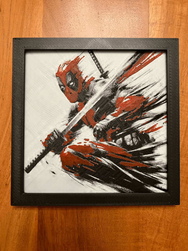 3D-printed wall art inspired by a quirky mercenary character, featuring bold red and black hues, framed in an 8x8 design and crafted from durable PLA