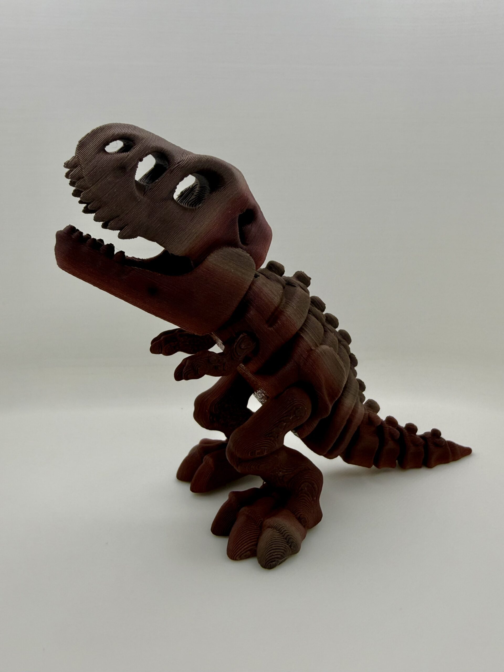 3D Printed Skeleton T-Rex Figurine | Articulated Dinosaur Fossil Desk Toy | High-Quality Gradient Tigerwood PLA Display | Prehistoric Aesthetic Gift - Image 2
