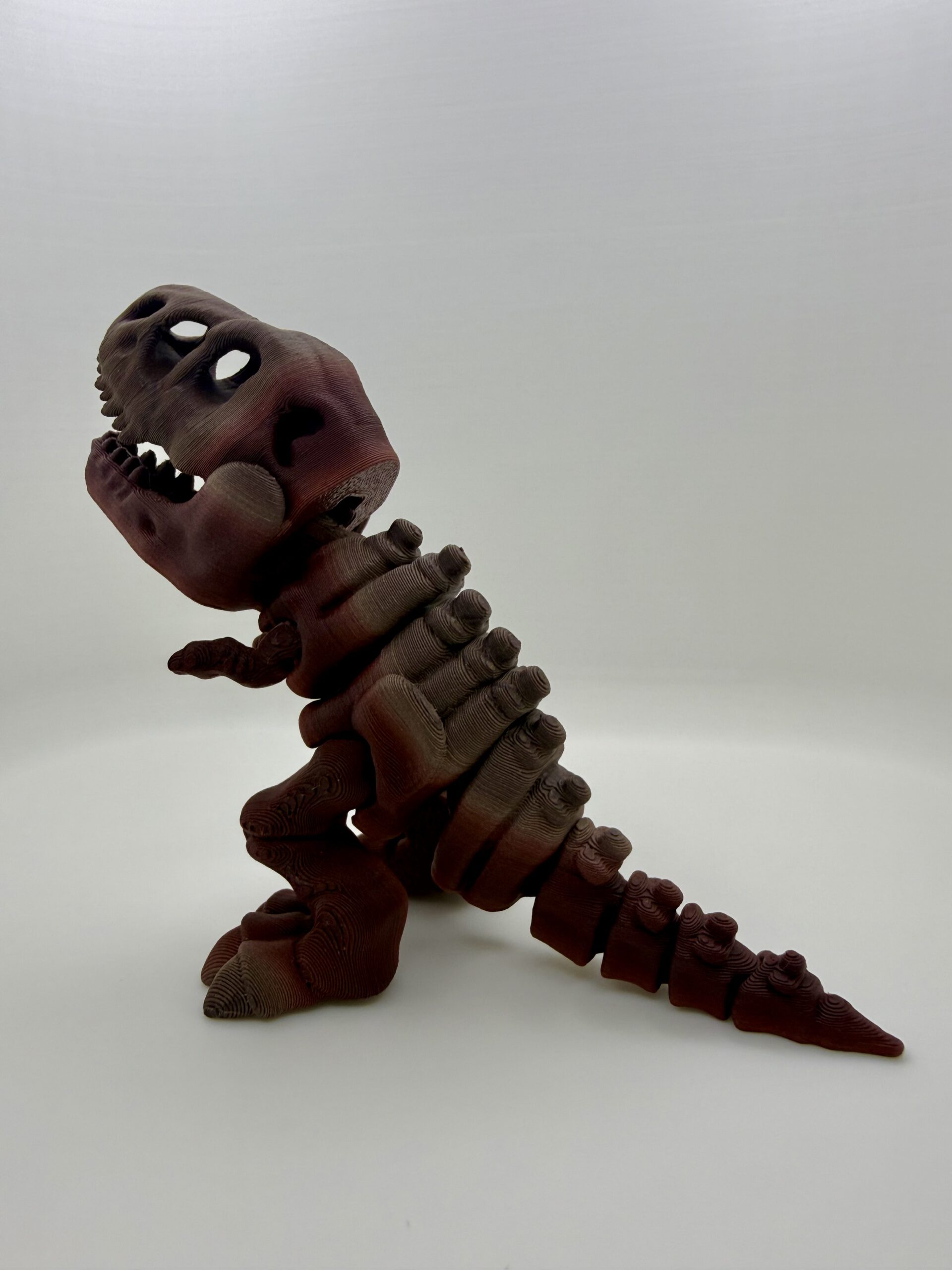 3D Printed Skeleton T-Rex Figurine | Articulated Dinosaur Fossil Desk Toy | High-Quality Gradient Tigerwood PLA Display | Prehistoric Aesthetic Gift - Image 3