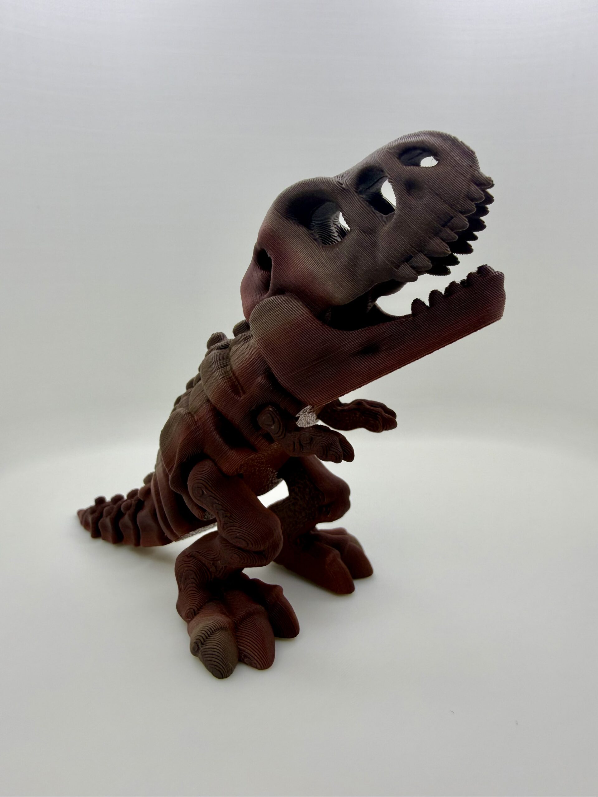 3D Printed Skeleton T-Rex Figurine | Articulated Dinosaur Fossil Desk Toy | High-Quality Gradient Tigerwood PLA Display | Prehistoric Aesthetic Gift - Image 5