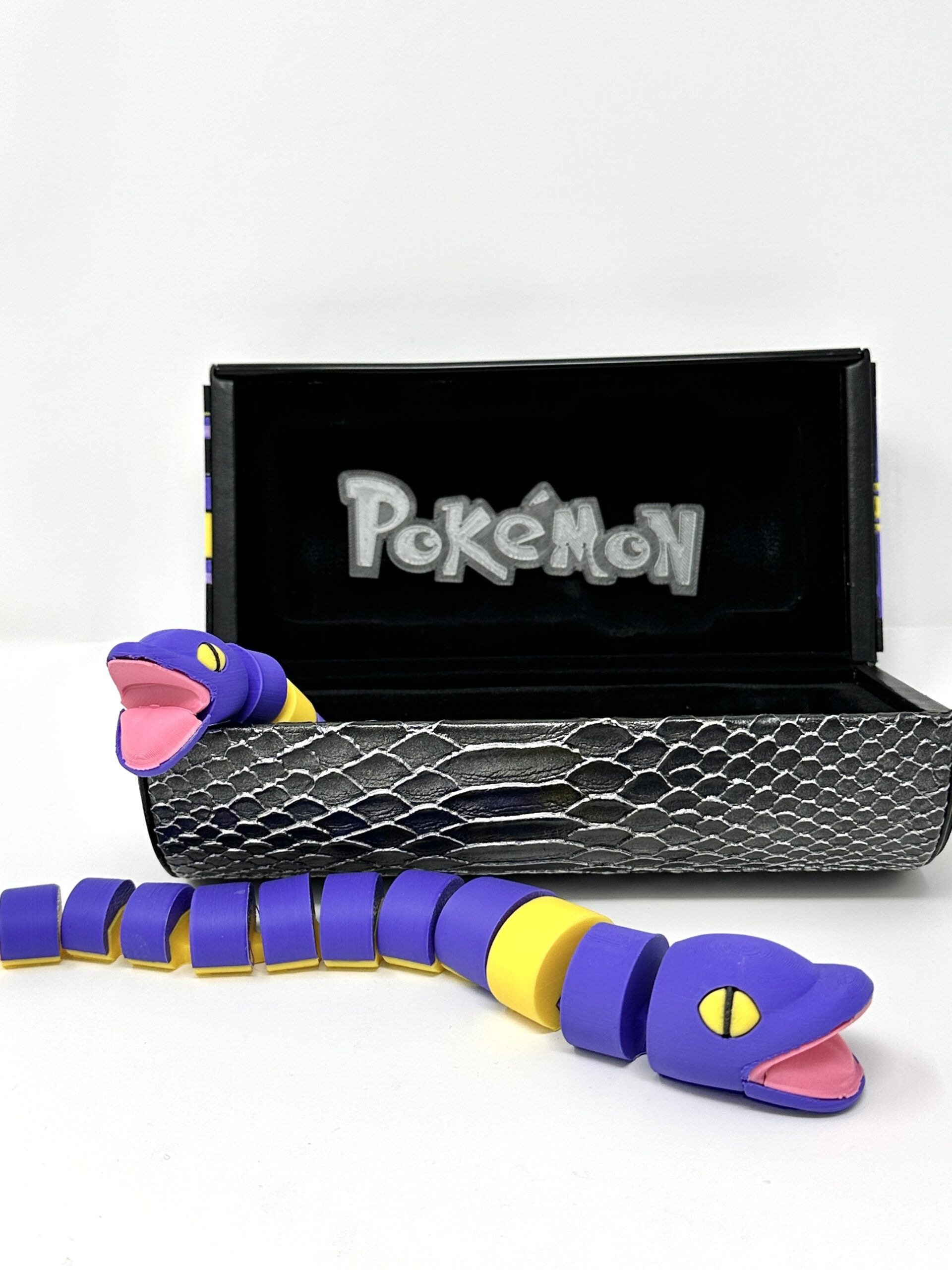 Upcycled Ekans Snakeskin Vault Case – Luxury Display Box with Flexi Pokemon